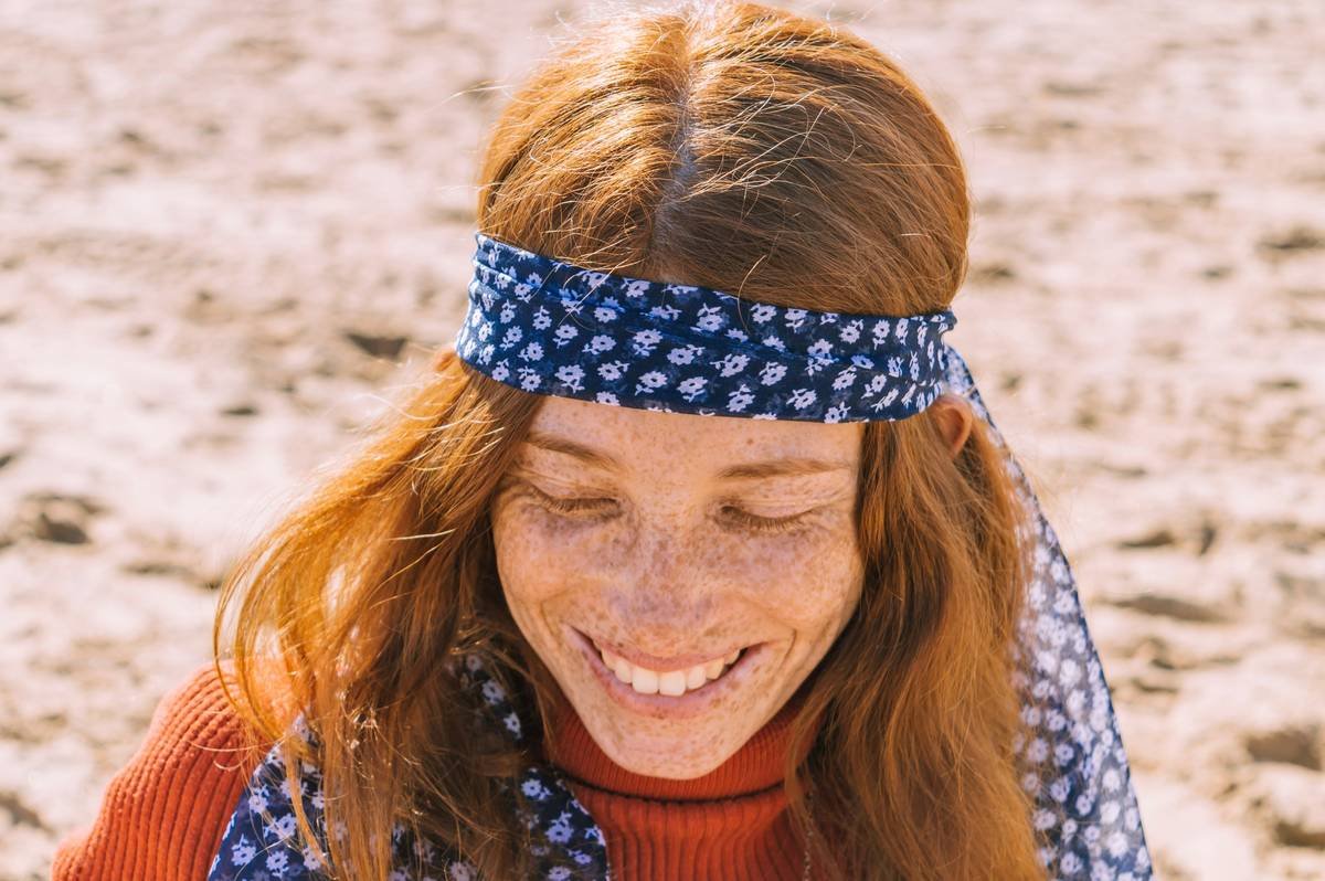 Woman wearing boho headbands while running errands, staying securely in place