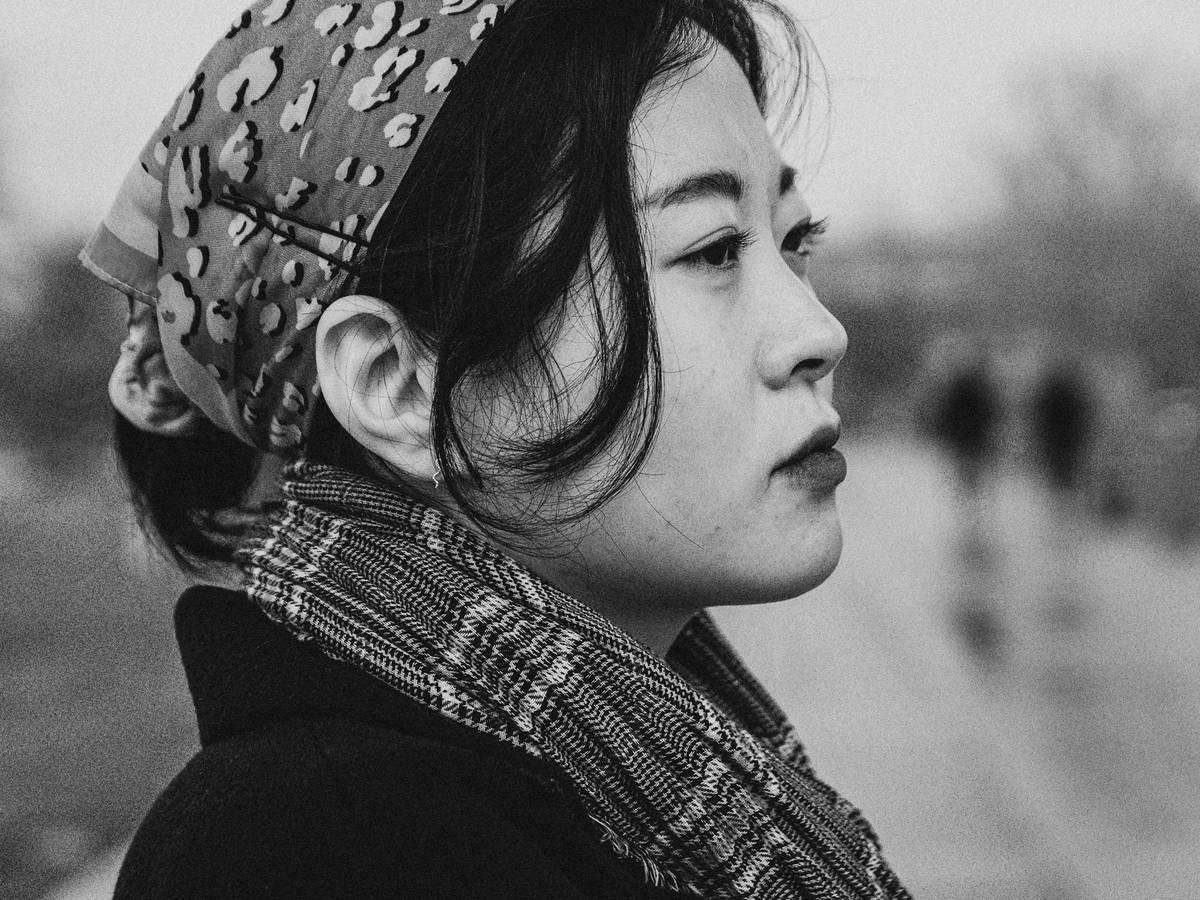 woman wearing floral hair scarves tied loosely around her bun